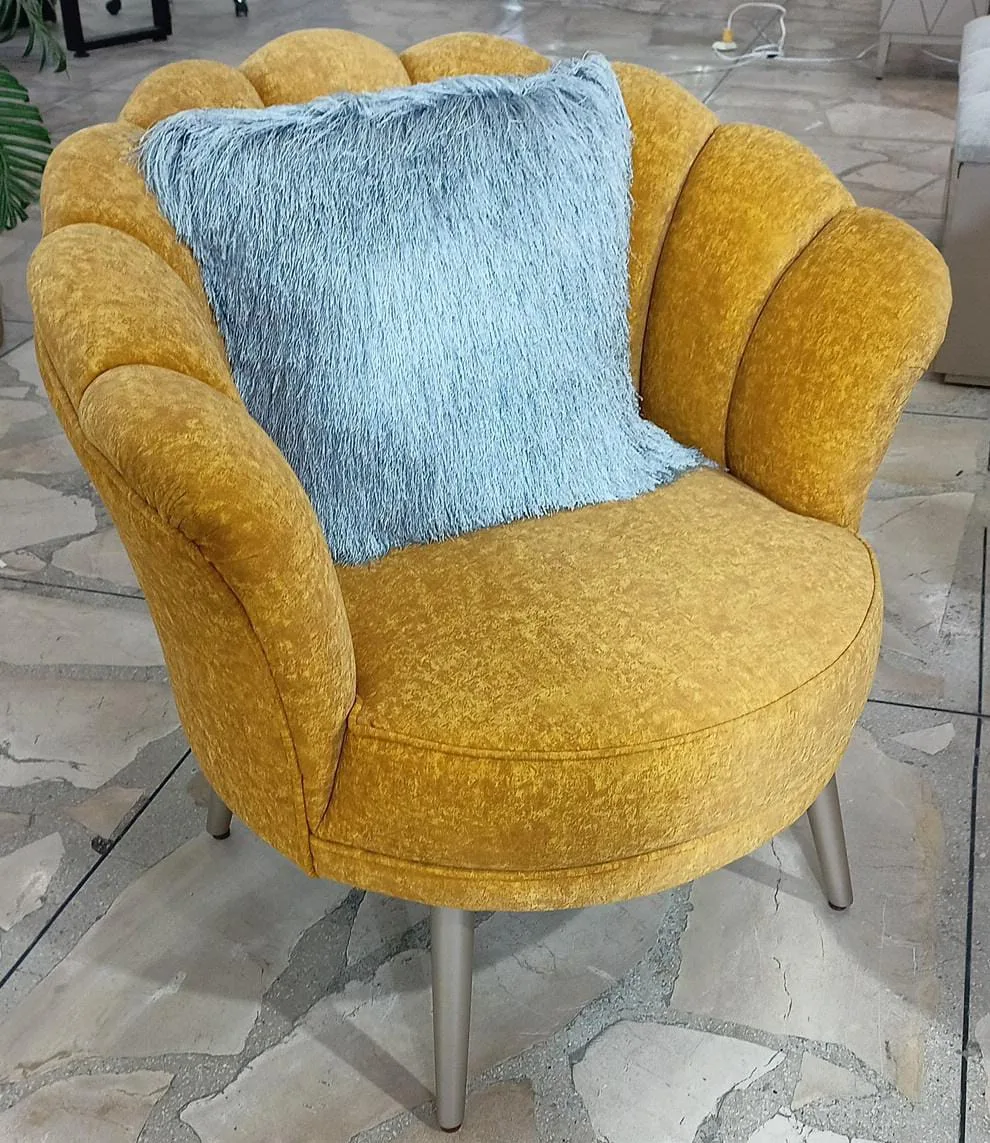 Sillón capitoné respaldo concha