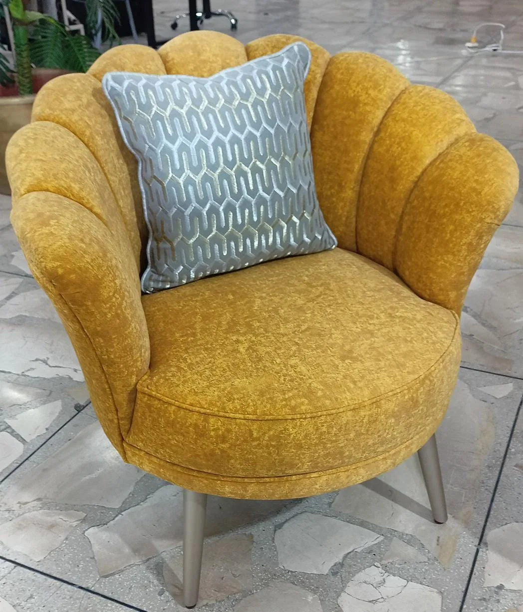 Sillón capitoné respaldo concha