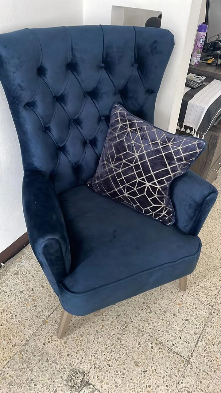 Sillón orejero capitoné