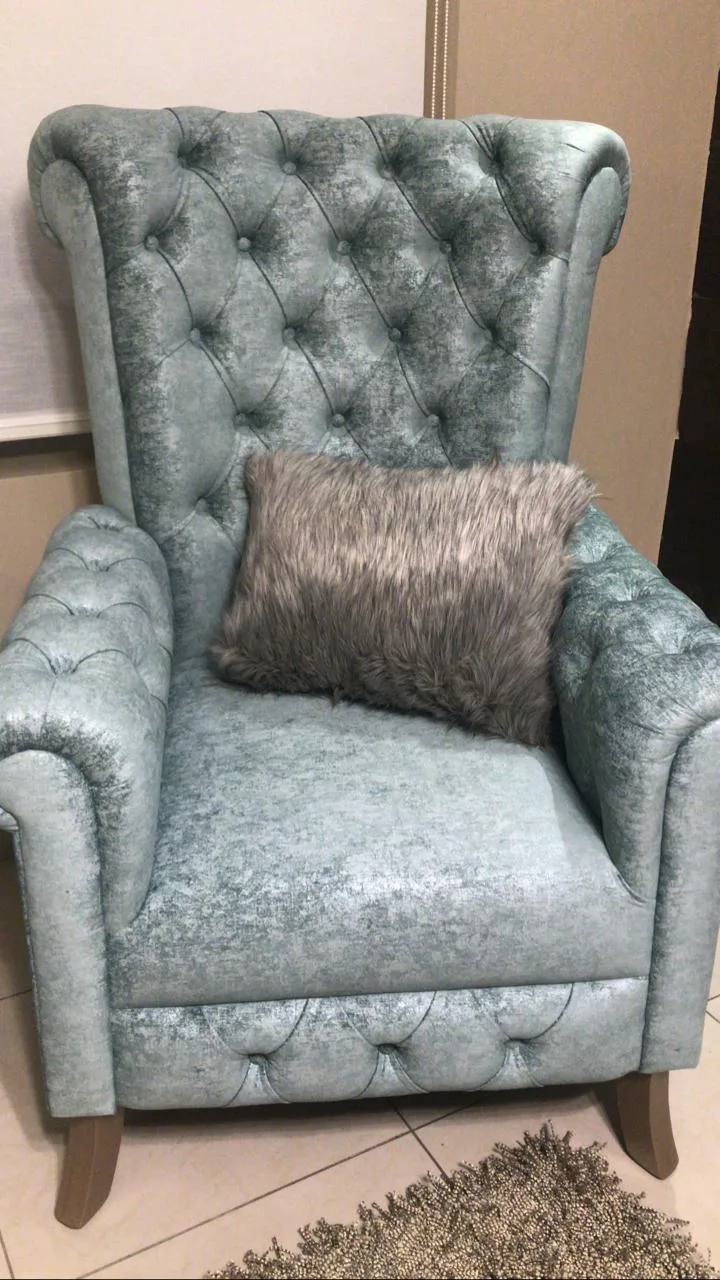 Sillón orejero capitoné