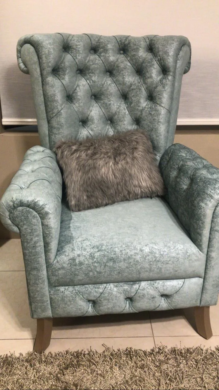 Sillón orejero capitoné