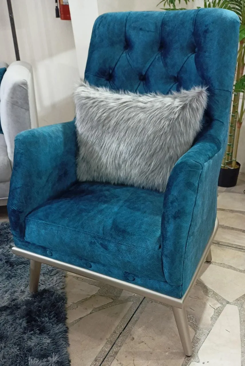 Sillón orejero capitoné